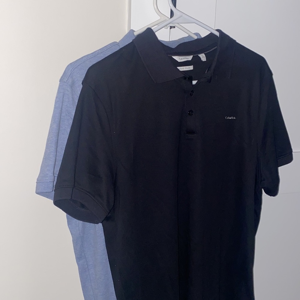 2 Calvin Klein polo shirts size medium 🖤💙 one black & one blue polo